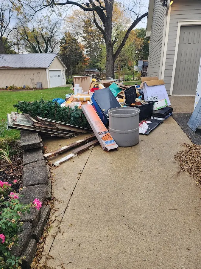 Dumpster being loaded with debris for Estate Cleanout Dumpster Rental in Harrisonburg